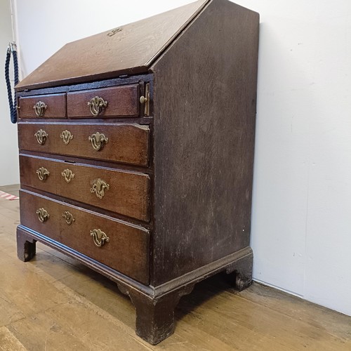 1020 - A 18th century oak bureau, with original handles, 92 cm wide