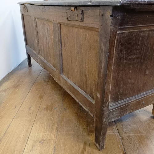 1026 - An 18th century oak coffer, carved lozenges, on stile legs, 140 cm wide