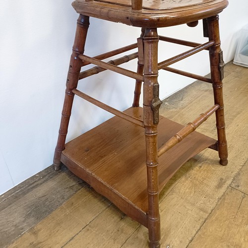 1029 - A childs metamorphic highchair, with faux bamboo supports, 100 cm high