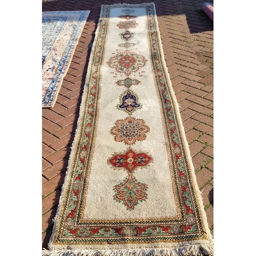 1041 - A Persian hand-made Tabriz runner, 410 x 74 cm