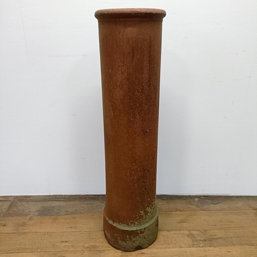 1042 - A terracotta chimney pot, 107 cm high