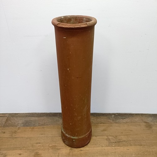 1042 - A terracotta chimney pot, 107 cm high