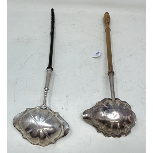 702A - A George III silver toddy ladle, with a spiral turned handle, and another (2)