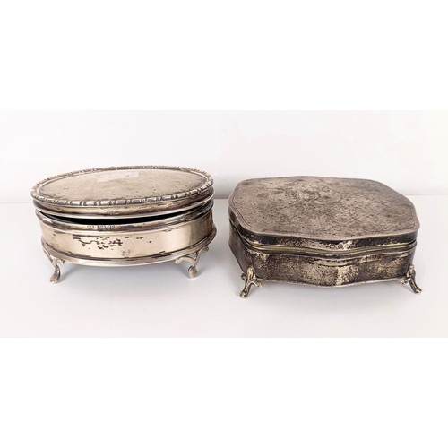 723A - A George V silver oval dressing table box, and another (2)