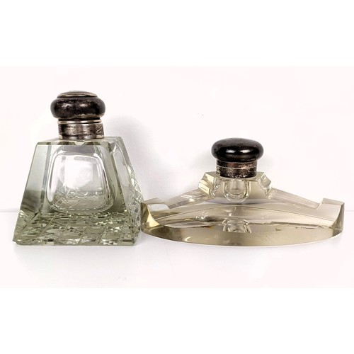 722A - A cut glass inkwell, with a silver mount, London 1948, and another (2)