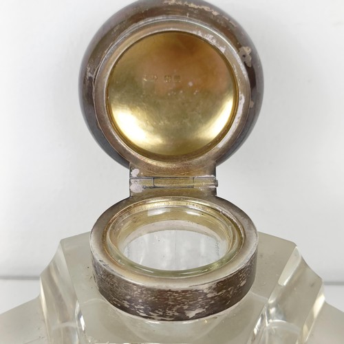 722A - A cut glass inkwell, with a silver mount, London 1948, and another (2)