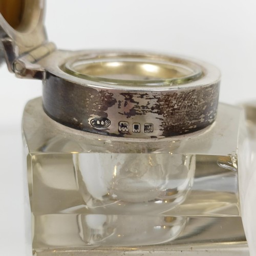 722A - A cut glass inkwell, with a silver mount, London 1948, and another (2)