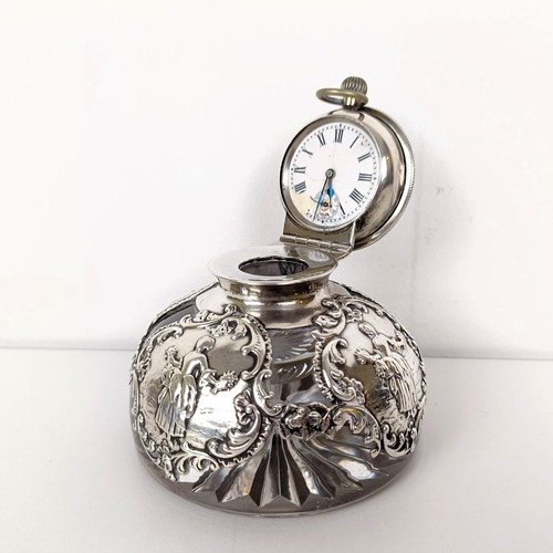 720A - An Edward VII novelty glass and silver mounted inkwell, the hinged lid to reveal a clock, London 190... 