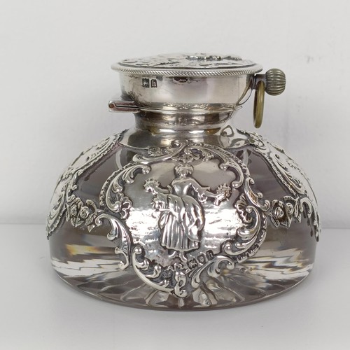 720A - An Edward VII novelty glass and silver mounted inkwell, the hinged lid to reveal a clock, London 190... 