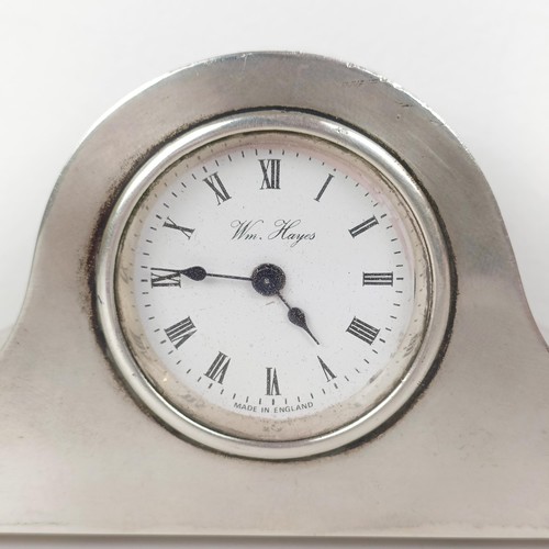 716A - A modern silver cased mantel clock, 17 cm wide