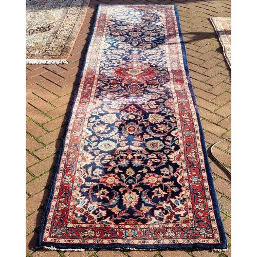 1053 - A Persian hand-made Kashan runner, 333 x 86 cm