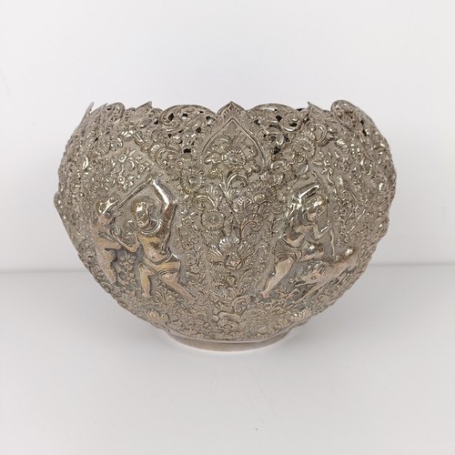 705A - A Burmese silver coloured metal bowl, decorated hunters, their prey, and repeated foliate forms