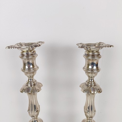 704A - A pair of George III style silver candlesticks, London 1909, 30 cm high (2)