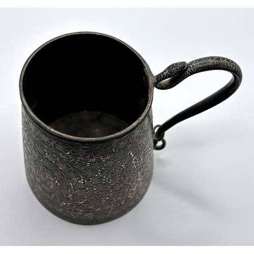 678 - An Indian silver coloured metal mug, with a serpent handle