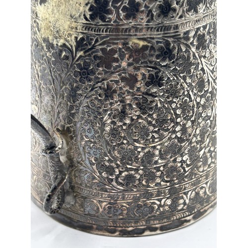 678 - An Indian silver coloured metal mug, with a serpent handle