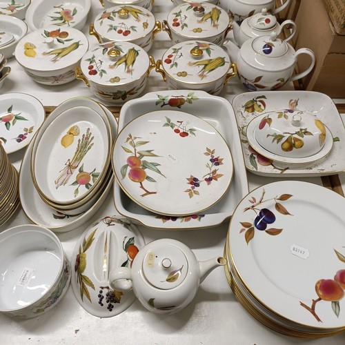 821 - An extensive Royal Worcester Evesham service, comprising plates, tureens, teapots, storage jars, cup... 