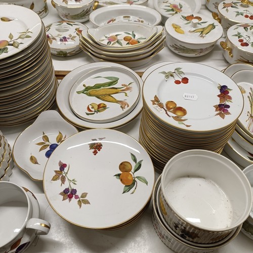 821 - An extensive Royal Worcester Evesham service, comprising plates, tureens, teapots, storage jars, cup... 