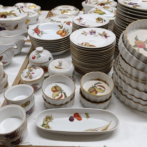 821 - An extensive Royal Worcester Evesham service, comprising plates, tureens, teapots, storage jars, cup... 