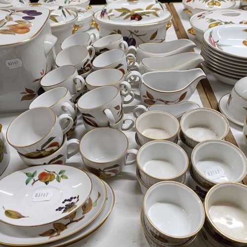 821 - An extensive Royal Worcester Evesham service, comprising plates, tureens, teapots, storage jars, cup... 