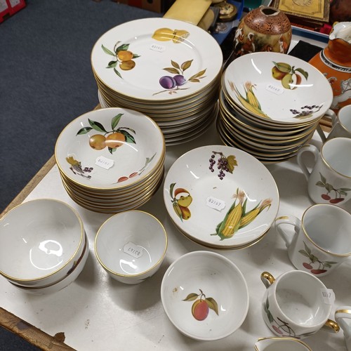 821 - An extensive Royal Worcester Evesham service, comprising plates, tureens, teapots, storage jars, cup... 