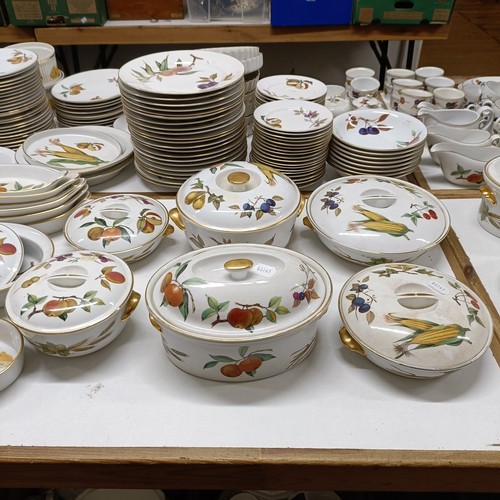 821 - An extensive Royal Worcester Evesham service, comprising plates, tureens, teapots, storage jars, cup... 