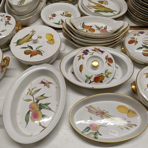 821 - An extensive Royal Worcester Evesham service, comprising plates, tureens, teapots, storage jars, cup... 