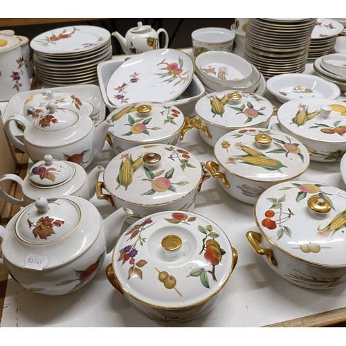 821 - An extensive Royal Worcester Evesham service, comprising plates, tureens, teapots, storage jars, cup... 