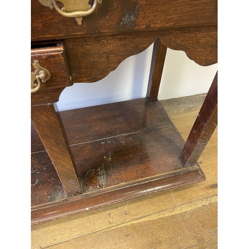 931 - A George III oak dresser base, with five drawers and a potboard base, 131 cm wide