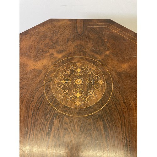 933 - A late Victorian inlaid rosewood octagonal two tier table, 77 cm wide