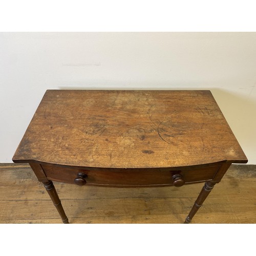 941 - A mahogany bow front side table, with a single frieze drawer, 90 cm wide