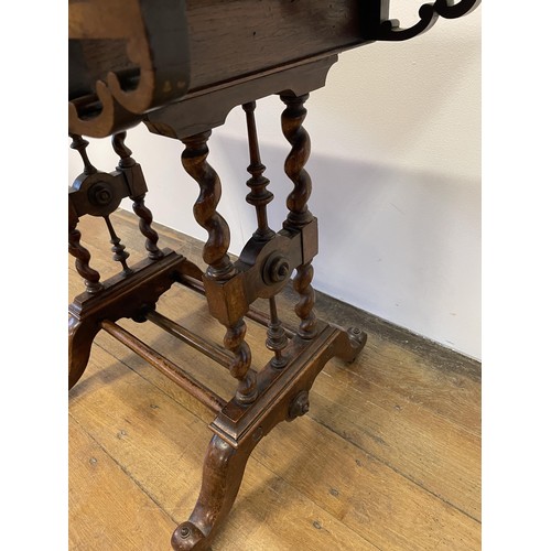 1005 - A burr oak folding card table, on barley twist twin end support to splayed legs, 81 cm wide