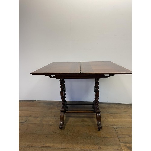 1005 - A burr oak folding card table, on barley twist twin end support to splayed legs, 81 cm wide