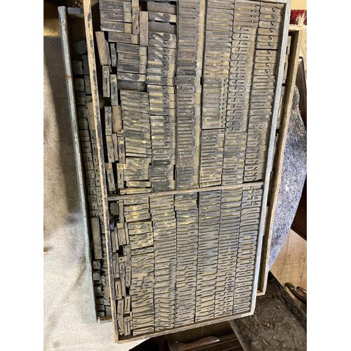 851 - A large quantity of vintage printing letter and image blocks, in thirteen trays