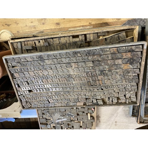 851 - A large quantity of vintage printing letter and image blocks, in thirteen trays