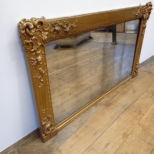 1063 - A gilt gesso overmantel mirror, 70 x 120 cm