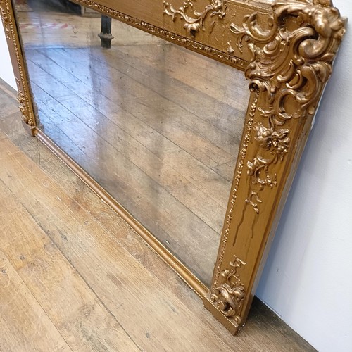 1063 - A gilt gesso overmantel mirror, 70 x 120 cm