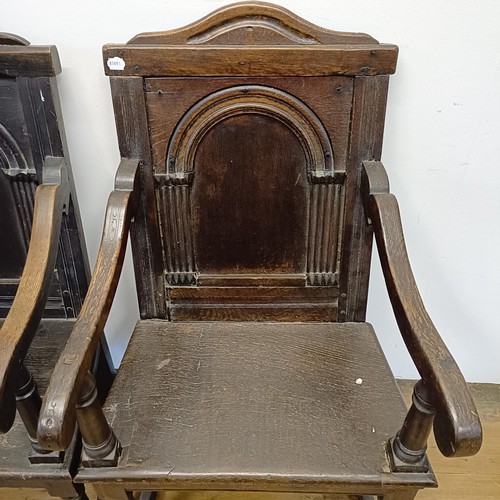 991 - A 17th/18th century oak wainscot armchair, with an arched panel back, on turned legs, and another, l... 