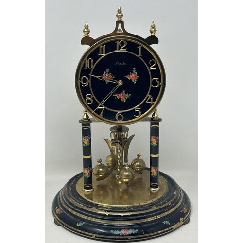 895 - A mantel clock, with an eight day movement, in a glass dome, 33 cm high