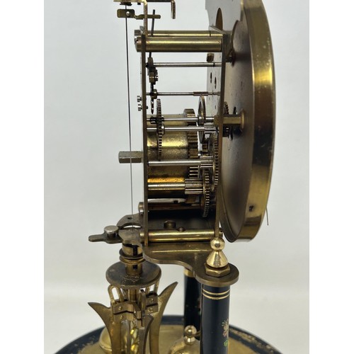 895 - A mantel clock, with an eight day movement, in a glass dome, 33 cm high