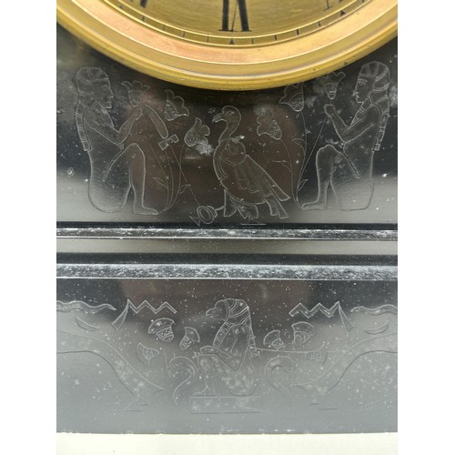 898 - A mantel clock, with an eight day movement, in a slate case, 27 cm wide