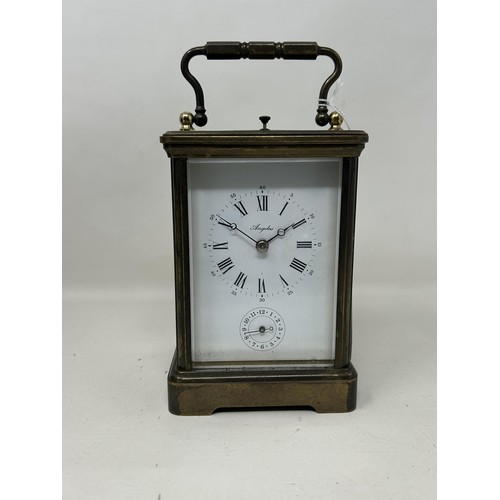 899 - A carriage clock, by Angelus, with a repeat and an alarm, in a faux snake skin travel case, 20 cm hi... 