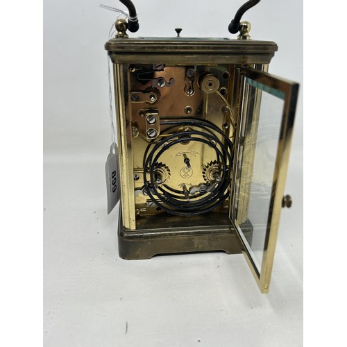 899 - A carriage clock, by Angelus, with a repeat and an alarm, in a faux snake skin travel case, 20 cm hi... 