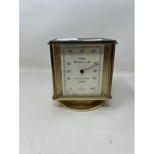 900 - A desk clock, by Sewills of Liverpool, with four dials, and a mantel clock (2)