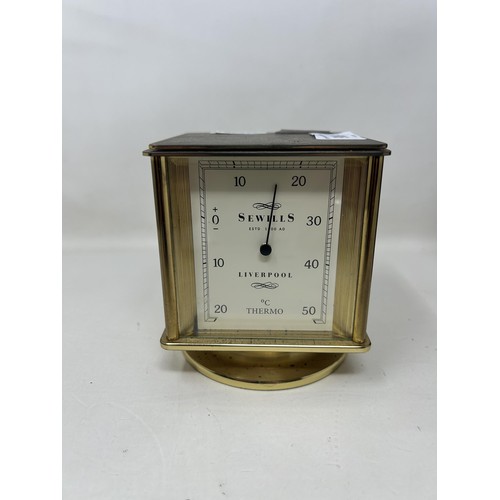 900 - A desk clock, by Sewills of Liverpool, with four dials, and a mantel clock (2)