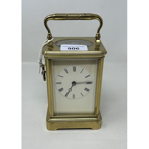 906 - A carriage clock, with a lever platform escapement and an eight day movement, in a brass and glass c... 