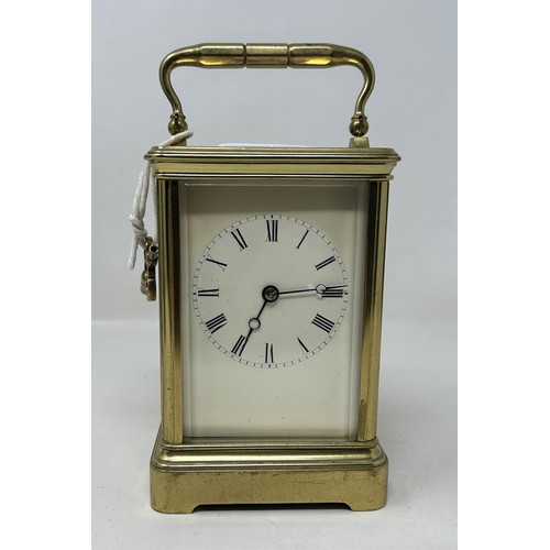 906 - A carriage clock, with a lever platform escapement and an eight day movement, in a brass and glass c... 