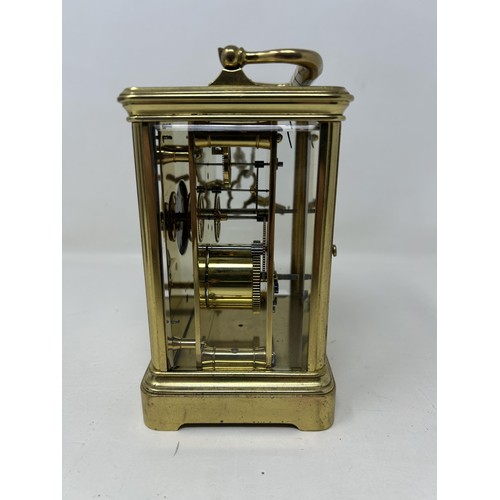 906 - A carriage clock, with a lever platform escapement and an eight day movement, in a brass and glass c... 