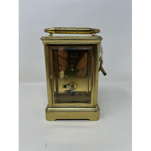 906 - A carriage clock, with a lever platform escapement and an eight day movement, in a brass and glass c... 