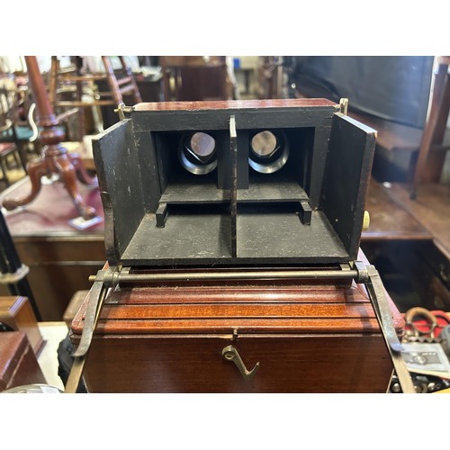 894 - A 19th century mahogany cased stereoscope viewer, and assorted slides, in a mahogany case, 48 cm x 2... 