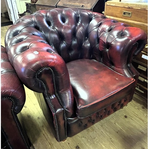 973 - A Chesterfield style red leather armchair